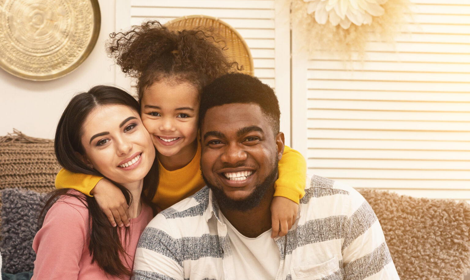 Happy international family hugging and staying at home during epidemic